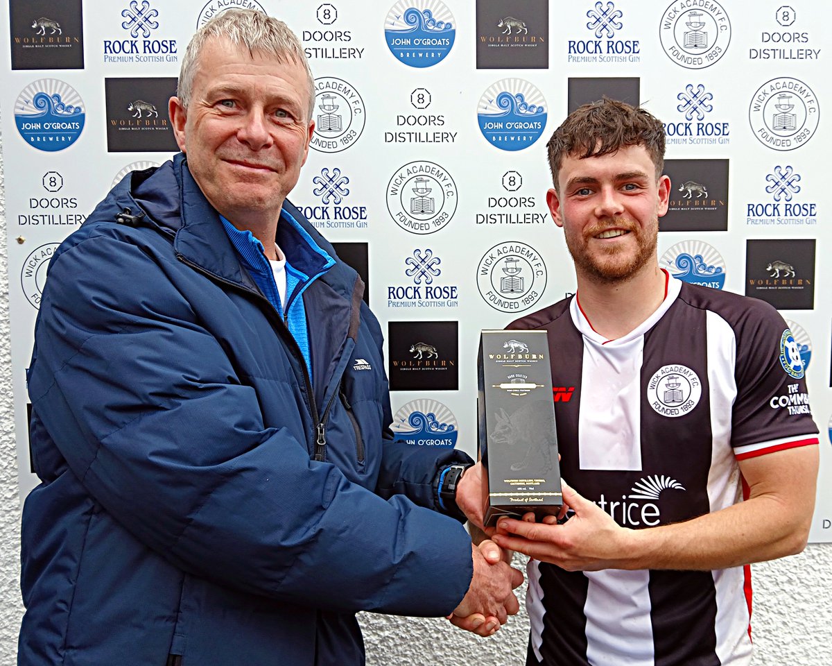 WickAcademyFC's tweet photo. Wick Academy midfielder Marc Coghill receiving his man of the match prize, a bottle of Wolfburn whisky, after today's 2-0 win against Fraserburgh. It was handed over by Donald Fraser, formerly of Wick, who had travelled up from Edinburgh for the game. https://t.co/FDqnFLOFHR