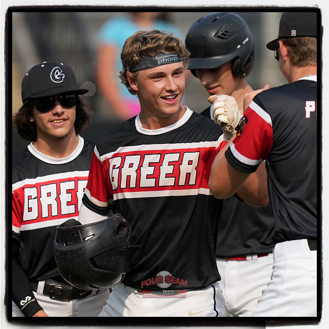 Catcher Cole Bellinger (7) of the Post 115 Greer Warhawks is greeted after hitting a home run in a South Carolina American Legion playoff game against Fort Mill Post 43 on Saturday, July 27, 2024, at Stevens Field in Greer, South Carolina. (Tom Priddy/Four Seam Images)