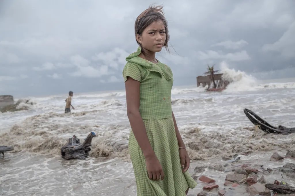 soutikBBC's tweet photo. Supratim Bhattacharjee is the winner of this year's Mangrove Photography Awards for this image of a young girl after a devastating storm in Sundarbans, India. She’s standing in front of her home and tea shop, destroyed by the sea during a storm.
https://t.co/1MDJBknpgs… https://t.co/FSCoO7cFAb