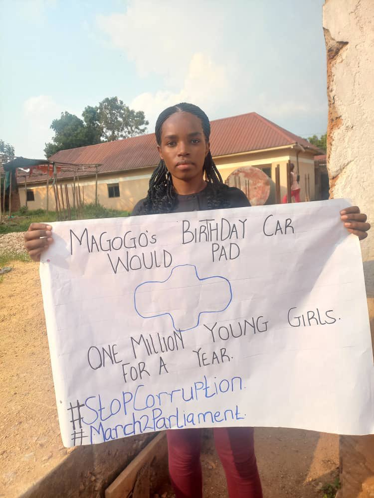 SarahBireete's tweet photo. NAMARA CLAIRE was arrested today at a church in Lubaga for holding this placard. She is being detained at a church police post. @KagutaMuseveni @PoliceUg @ODPPUGANDA arresting citizens for fighting corruption which is their duty under Art.17 is UNCONSTITUTIONAL #ReleaseProtesters https://t.co/xBbNELQuAO