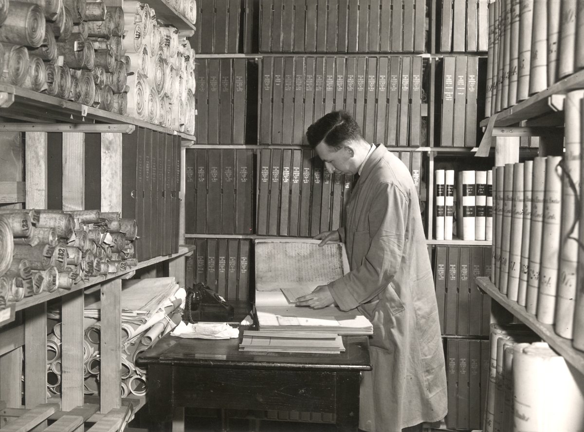 Some things change and some stay the same. Back in 1957, this Assistant Clerk of the Records was checking through our Main Papers collection and these volumes are still the same today. However, the rolled records on the shelves now have more protective packaging. #TowerHeritage