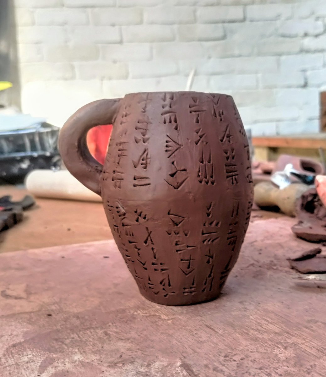 New mug project inspired by cuneiform cylinders. The handwriting and grammar would give Sumerians a heart attack!