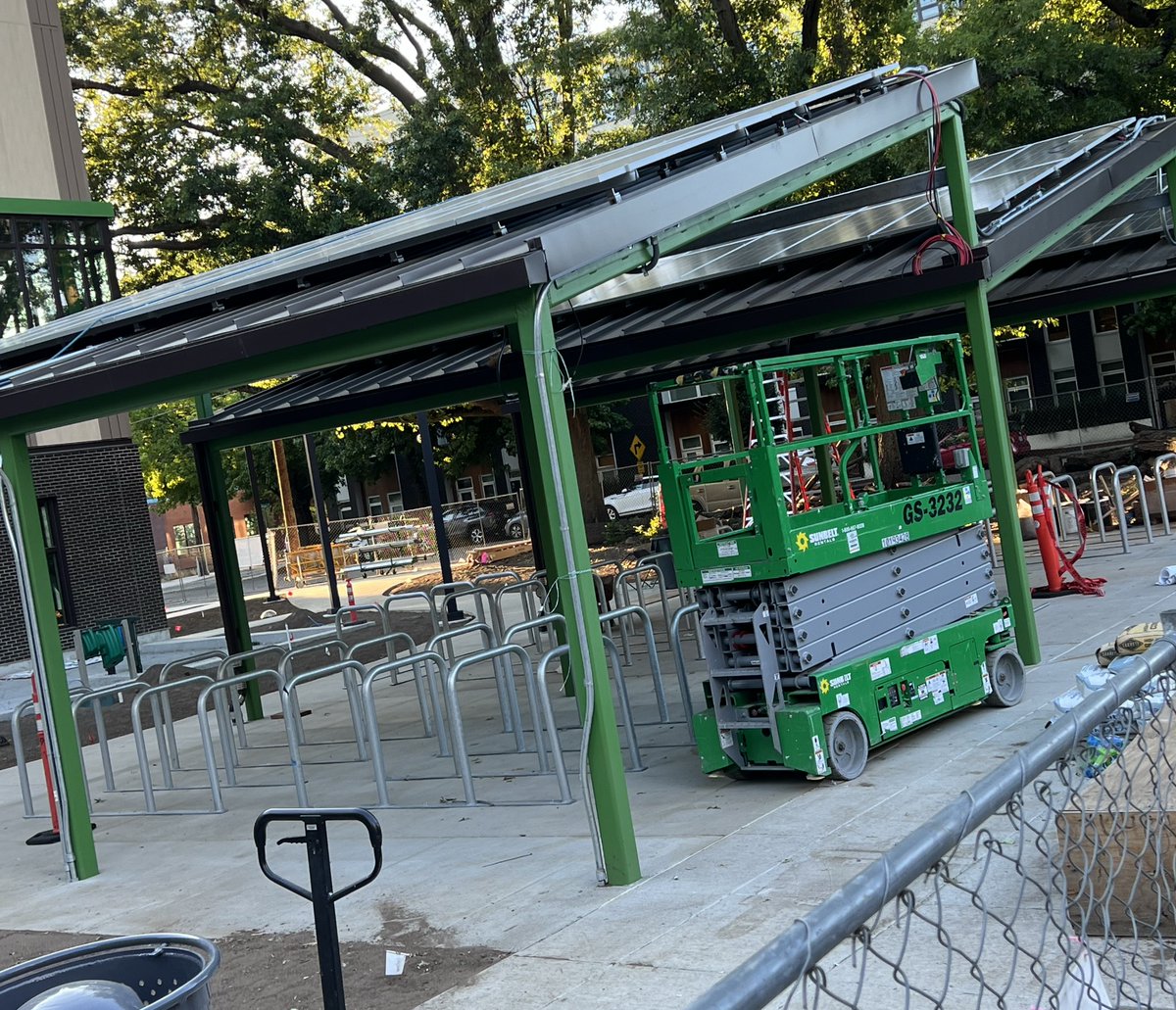 BikePortland's tweet photo. Solar-powered, covered bike parking at the new PPS Multiple Pathways to Graduation bldg on NE 16th and Glisan 😲👀 https://t.co/JRqnoyKSQj