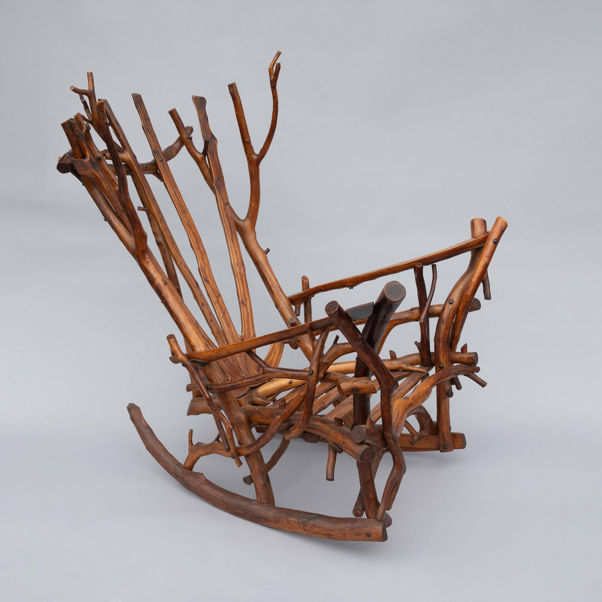 Get into the camping mood with this Adirondack-style rocking chair created c. 1925 by Clarence O. Nichols of Ossining, NY. While chopping dry cedar for firewood, Nichols was struck by the beauty of the individual pieces and used them instead to make this one-of-a-kind chair.