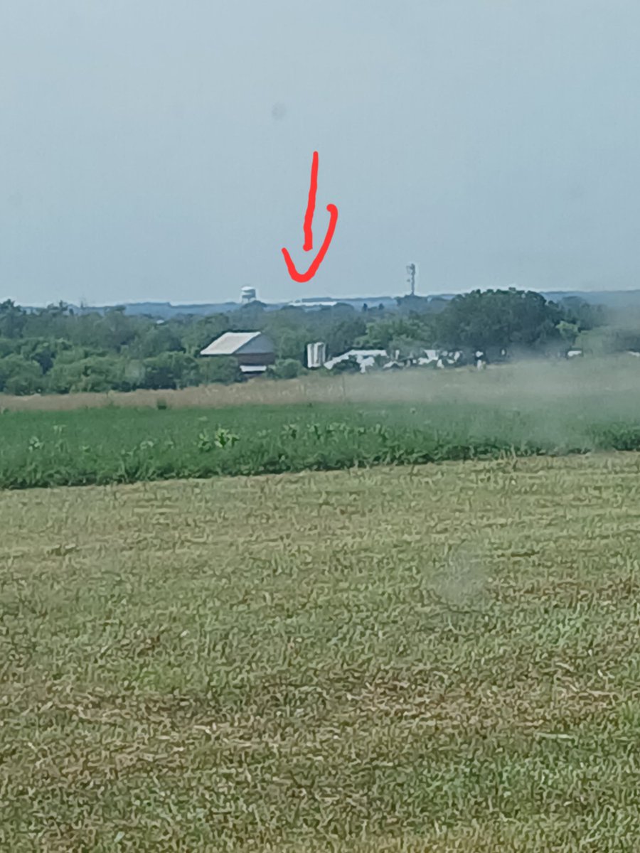 3furrowsjd's tweet photo. Waiting for trucks on the high spot on this particular farm and I realized you can see the tops of @KenSchaus new barns over near Walkerton 

They're the white object to the RH side of the water tower. Yes my phone takes awful pictures. https://t.co/rZ2zDB6mCY