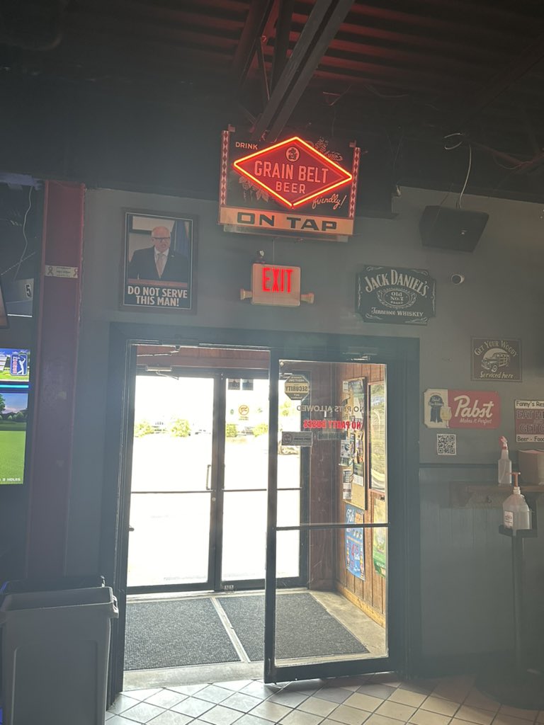 JenDeJournett's tweet photo. Dear @KamalaHQ @KamalaHarris , National & #MN local media - In my hometown of Maple Grove in very a blue collar sports regular bar in MN - above the door as you walk out - this is the picture of @GovTimWalz @Tim_Walz above the door. maybe #WalzForVP isn't a good idea #AskTheWhy https://t.co/IcqQqKDEoe