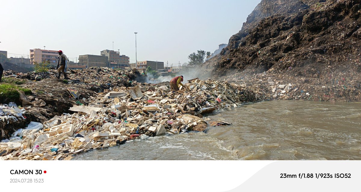 "Where the river's gentle flow meets the harsh reality of a dump site, we see a poignant reminder of our impact on the environment The river, once a symbol of life and purity  now faces the consequences of our neglect. This intersection calls us to act with greater responsibility