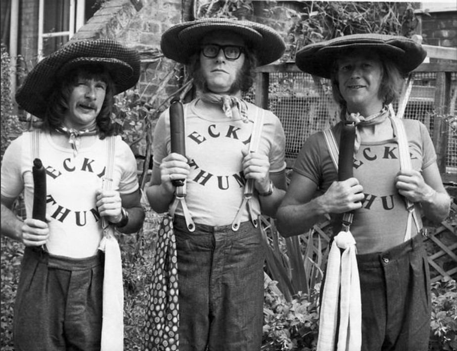 MostynField's tweet image. You'd have to be British and over 60 to remember this, but the Paris medal party uniforms remind me of a Goodies episode from the 70's. The episode was about "Ecky Thump" which was a Lancastrian martial art involving black puddings, in which the Goodies wore oversized flat caps