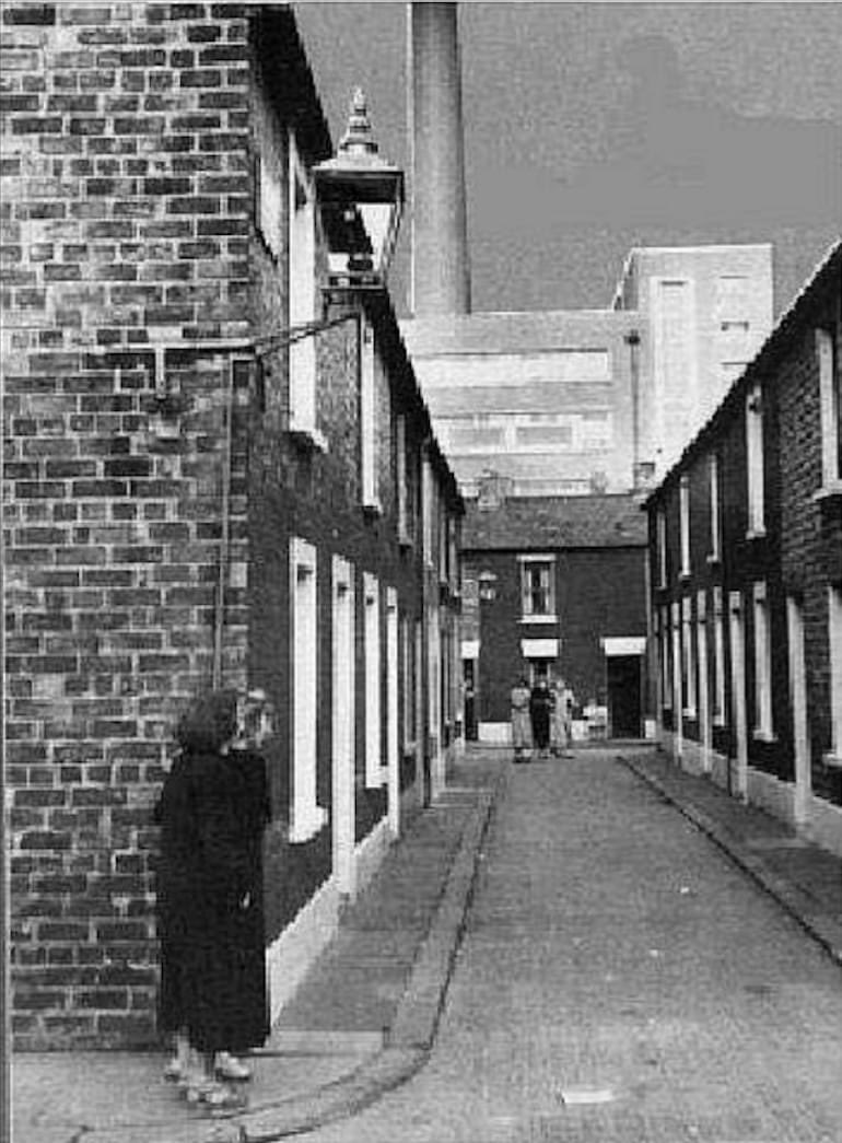 gallaher tobacco factory belfast Economy Place / Moffat Street, York Street area, Belfast. The old Gallaher's  Tobacco Factory in the background which is now Cityside/Yorkgate. c1950s.  (EPC)
