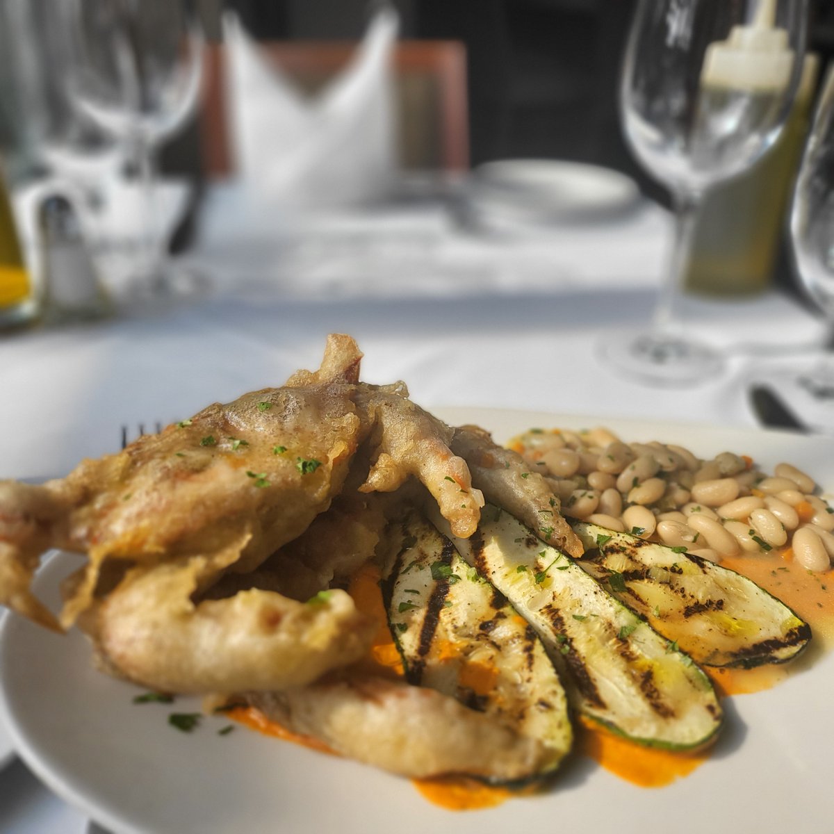 Crispy soft shell jumbo crab, romesco sauce, grilled zucchini, braised white beans, fresh herbs, extra virgin olive oil feature tonight by Executive Sous Chef Walter Blakiewicz