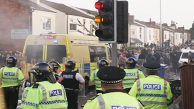 sanjoychakra's tweet photo. UK- Violent clashes between far-right protesters and police have erupted outside a mosque in Southport following a knife attack that killed three children. 
Thirty-nine officers were injured during the trouble Eight other children suffered stab wounds and five are in a critical  condition, alongside two adults who were also critically injured, police  said. 
Supporters of the English Defense League began to throw items towards the mosque at around 7.45pm.  
A 17-year-old boy, who cannot be named for legal reasons, remains in  custody accused of murder and attempted murder following the incident at  the dance studio in Hart Street.(From Independent)