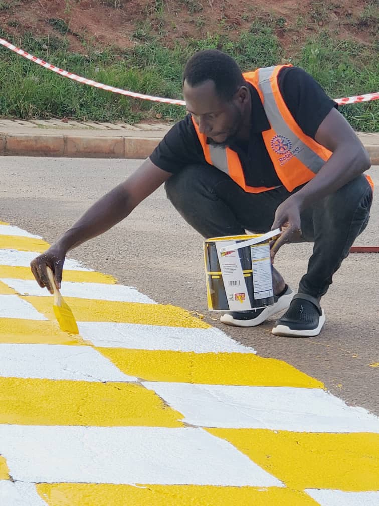 The magical president of rotaract club of mubende metro designing zebra crossing # doing magic 🪄