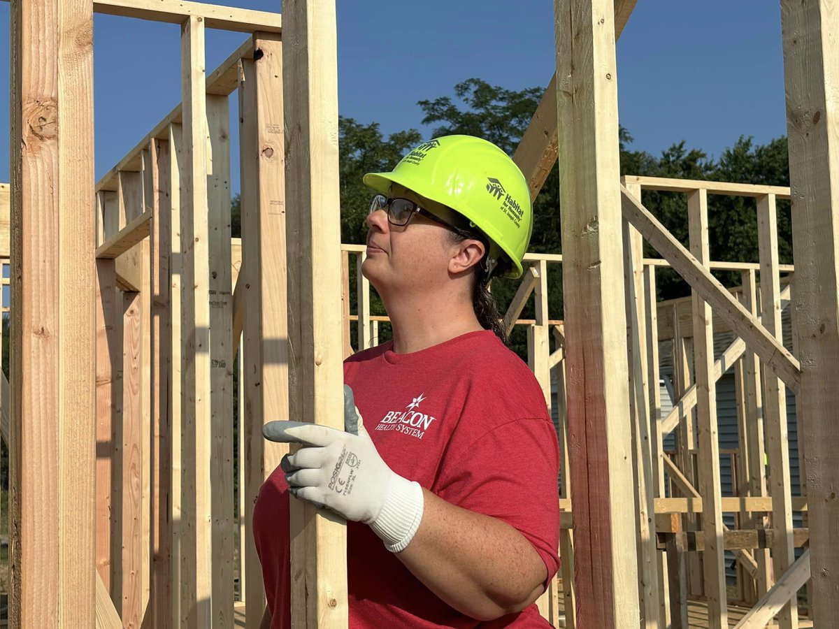 Indeed, a house is being constructed, but friendships and community are being built on a foundation based on loving thy neighbor, something we can all use more of. Stephanie (red shirt) is a future homeowner, helping to build her neighbor's home. 

#HFHI #Strength #Hope