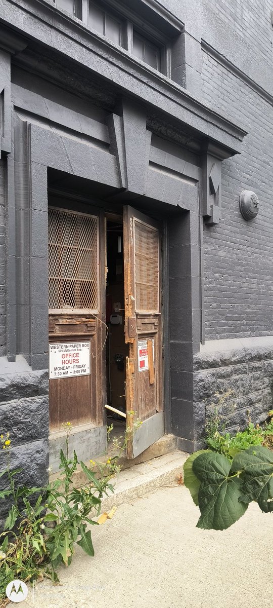 A ladder is at the back of the building of 579 McDermot. Front door is open. Not safe at all. For anyone.