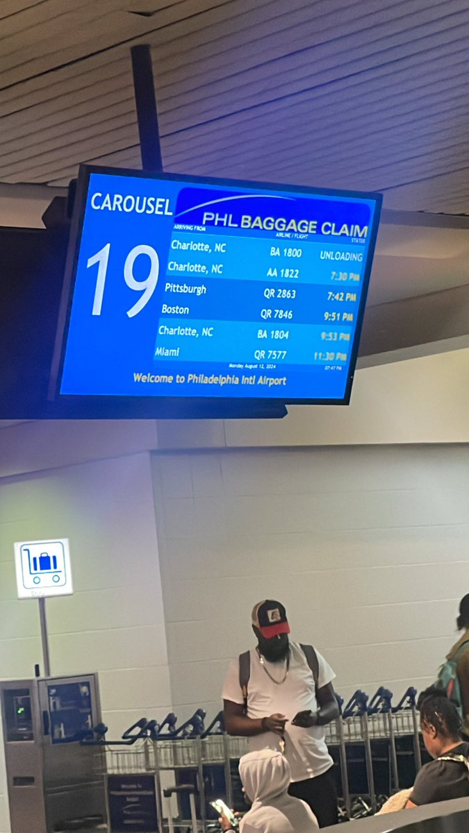 docfink's tweet photo. “Arrived” or “unloading” @PHLAirport @AmericanAir which one is right, your app or your sign? #disgraceful Where are your customer service agents?#whereareourbags https://t.co/X7BcrjuKre