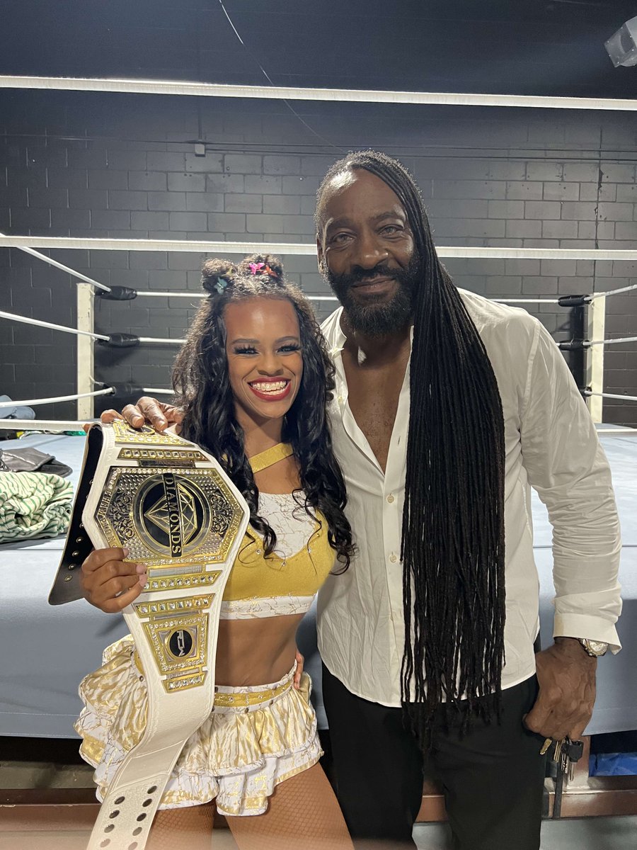 labougicana's tweet photo. 12 years in the making. #AndNew @TheOfficialROW Women’s Champion! Smooches, @BookerT5x y @bradgilmore. 💋🏆😌

#ChanelNo5 #bougiecollection #BlessedAndGrateful https://t.co/xG8lLwUNth