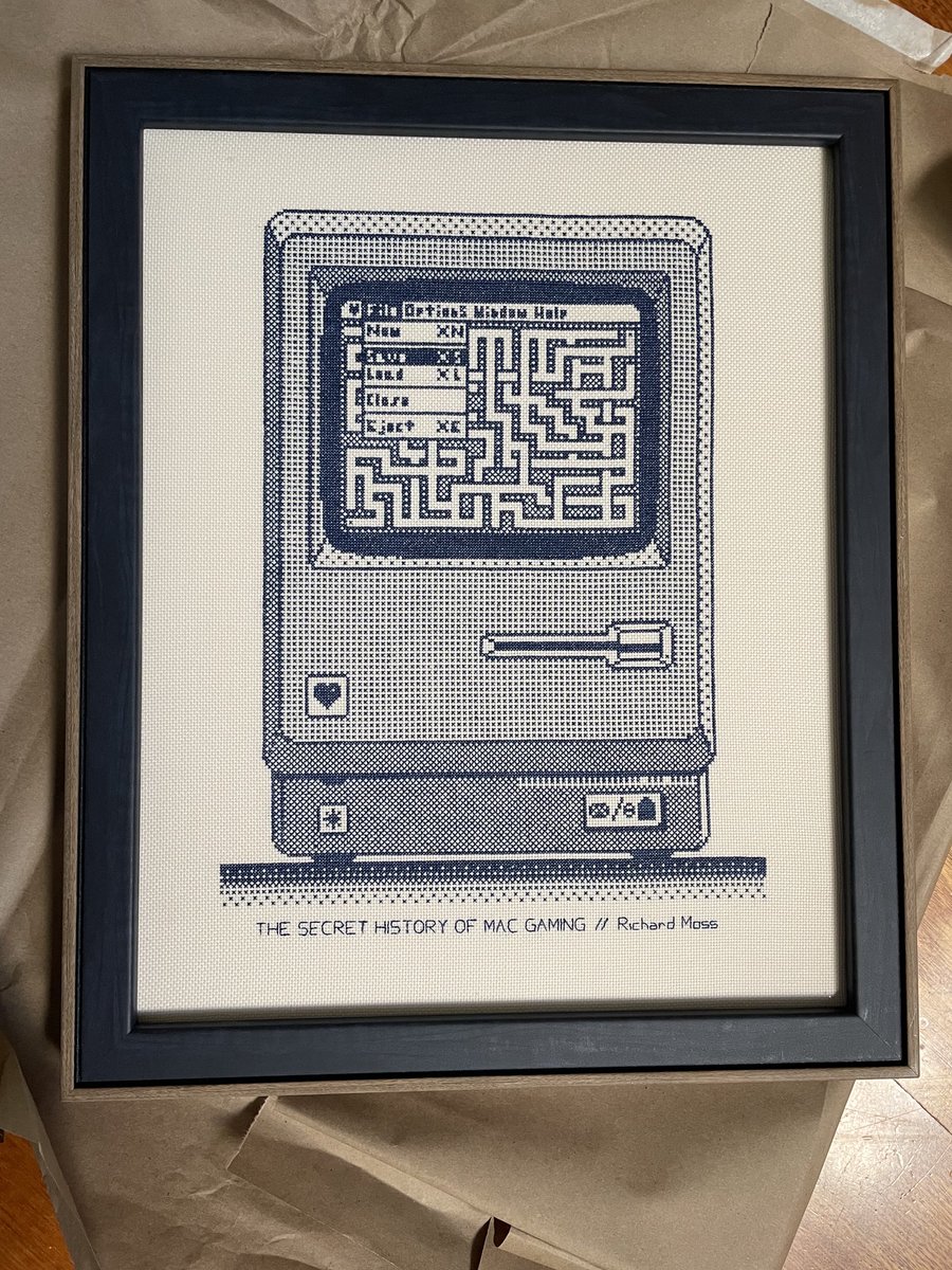 The legendary Mac game programmer Glenda Adams (who did ports of Tomb Raider, Unreal, EverQuest, Duke3D, Links, and many other titles) made this beautiful cross stitch of my Secret History of Mac Gaming book cover and sent it to me. It looks even better in the flesh.