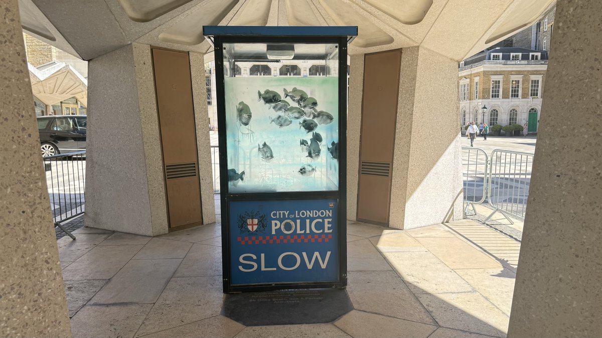 cityoflondon's tweet image. Lots of people viewing the #Banksy artwork at its new temporary home in #GuildhallYard. Our colleagues carefully moved the piece here last night. It's now secure and can be viewed safely. A permanent home will be announced in due course. #DestinationCity @CityPolice