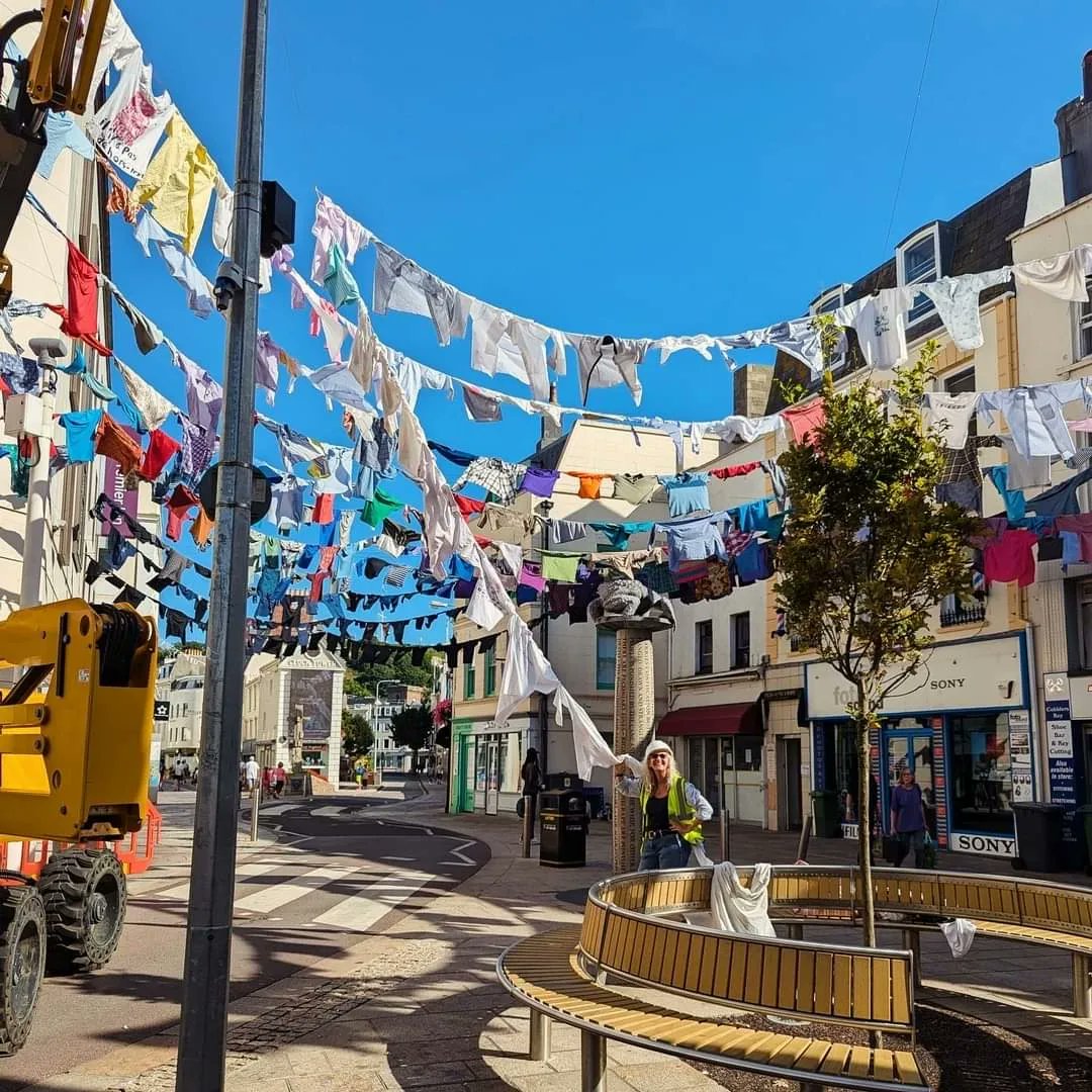 ArtHouse Jersey 's public artwork, 'Dancing Together' by Kaarina Kaikkonen, is now on display in Charing Cross until October.

Ronez's PPE shirt is among 700 donated by Islanders, each representing a special memory, story or emotion.

#ButterfieldJersey