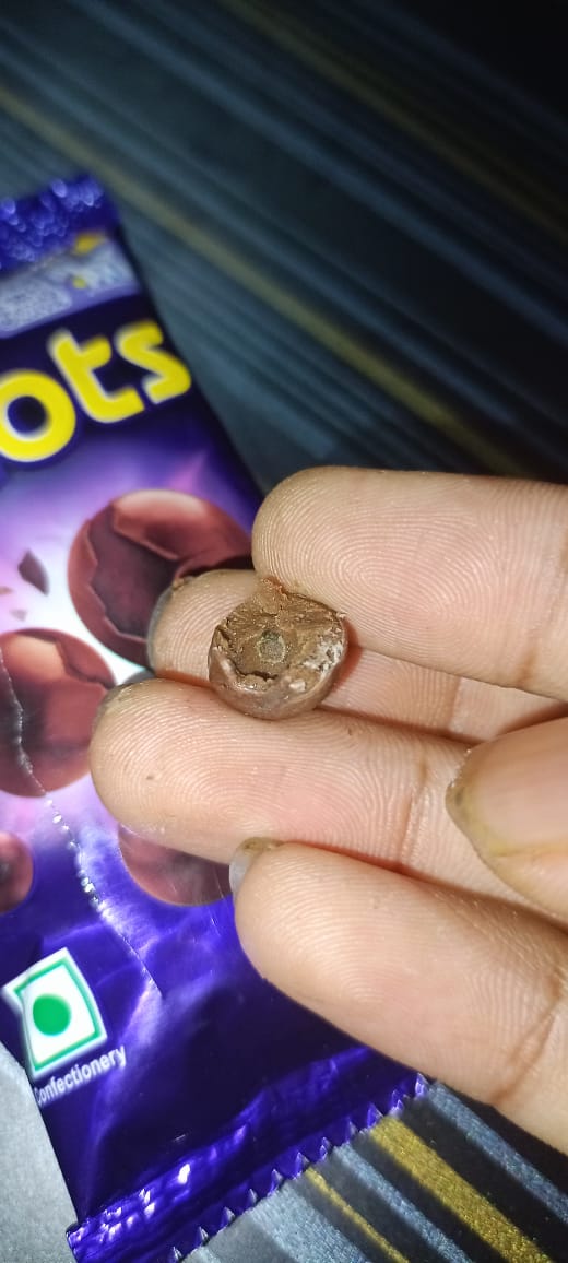 Navin12081997's tweet photo. Disgusted to find a bug in my Cadbury Dairy Milk Shots packet! 🤢 This is completely unacceptable. @DairyMilkIn @fssaiindia @MDLZ Please take immediate action. Your quality control is seriously questionable. #Cadbury #FoodSafety #Disappointed #Shocked #Unhygienic https://t.co/XIAUqwFQpI
