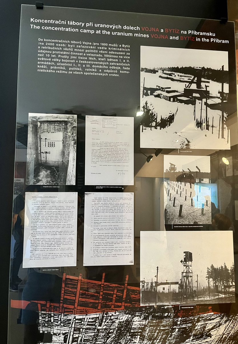 Colour matters - the panel was placed in the gloom of a building corridor and suffered from the glare of artificial light. The shade of red undoubtedly has a hidden meaning but its use in the text makes it difficult to read and see p.e. the names of the concentration camps.