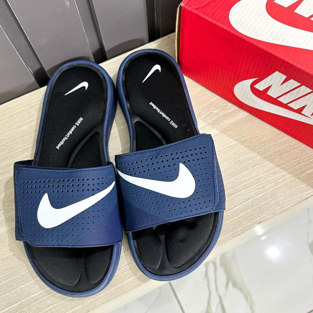 NIKE COMFORT FOOTBED SLIDES NOW
AVAILABLE IN STORE IN FOUR (4)
COLORWAYS 
 40-45
 N30,000✅✅