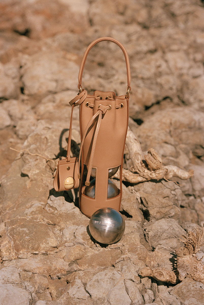 YSL's tweet photo. Endless Summer
by Anthony Vaccarello
Photographed by Purienne
Pétanque set with brown leather case
https://t.co/oQeweZkH01
#YSL #YvesSaintLaurent #SaintLaurent #SLRD #SaintLaurentBabylone https://t.co/FmYPX4rsWq
