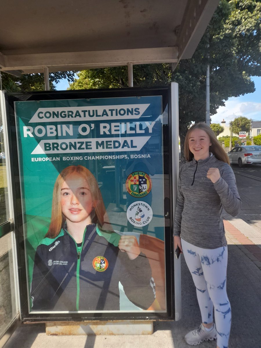 paulykinsella's tweet photo. Monkstown BC’s Robin O’Reilly proudly stands at her advert at the Bus Stop near her home in Glasthule 🥊🇮🇪🤩🤩🤩 she arrived back at the weekend with a European Championships Bronze Medal 

Well deserved champ 🥊🇮🇪🌏👏👏👏
#Community https://t.co/qUAOK3jhHR