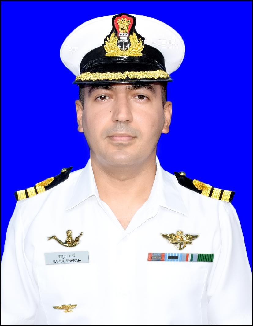 ANI's tweet photo. Marine Commando Commander Rahul Sharma was awarded the Nau Sena Medal Gallantry for planning and leading rescue operations in the merchant vessel Ruen. Preparing for a mission 1400 nautical miles off Mumbai, he showcased unmatched prowess in tactical planning and inter-agency collaboration. He led a daring para-drop of MARCOs from C-17 aircraft deep into the Arabian Sea, coordinating with IAF for precise deployment. After leading the para-drop of the team, the officer also commanded the high-risk boarding of MV Ruen, personally overseeing the thorough sanitisation of the ship by splitting the teams to form three assault groups, each responsible for different sections of the ship. His tactical acumen ensured the swift and effective clearing of the vessel, securing RPG rounds, AK Ammunition and other piracy-related stores, thereby neutralising any threat(s).