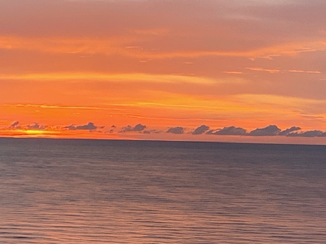 🌇 Wind down your evenings with a glass of wine, basking in the glow of spectacular sunsets from your private balcony. Hashtags: #SunsetViews #EveningGlow #BeachfrontLiving"