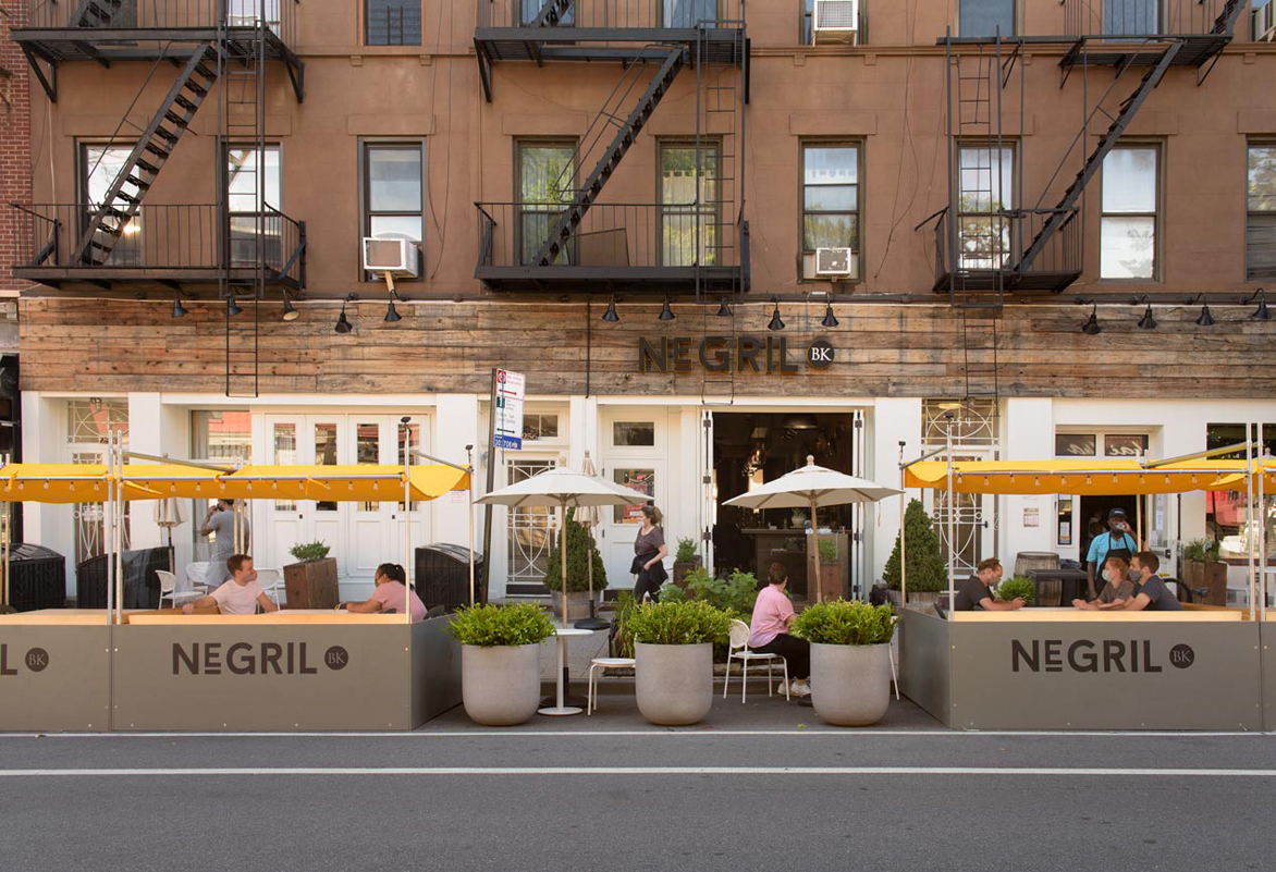StreetsblogNYC's tweet image. The death of great public space continues as @NegrilBK demolishes its popular outdoor dining space (left in its heyday). Coming soon: space for stored cars that do no good for the public at all.