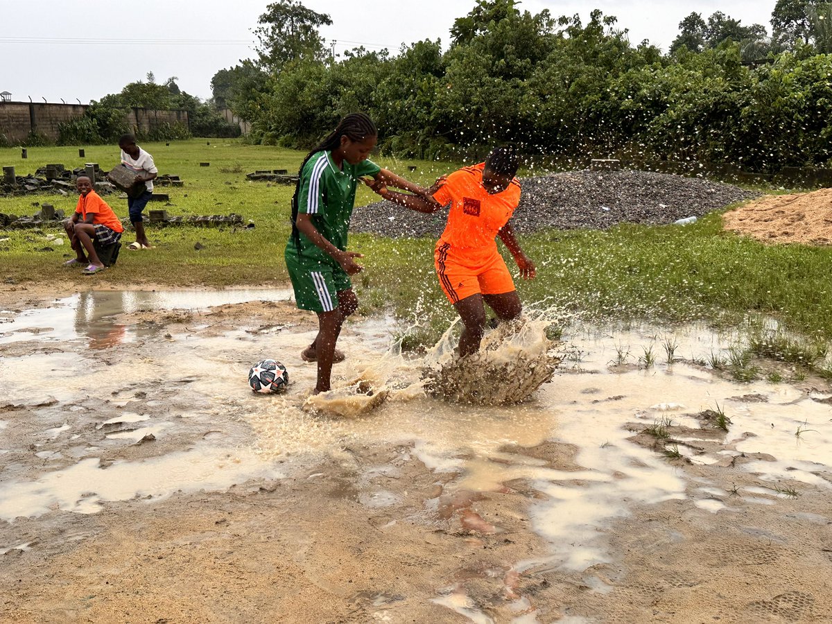 WfacCmr's tweet photo. The raining 🌧️/flooding days R back &amp; we’R out playing football bc we love to play but the weather/effects of climate change is making it difficult. Reason as we play, we ask gov/polluters to show some care &amp; compassion to the environment. We want 2 go out &amp; play in a clean env https://t.co/a5eJtrK61C