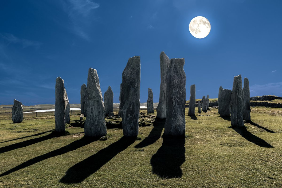 The full moon lights up the ancient Callanish Stones. Isle of Lewis, Scotland. NMP.