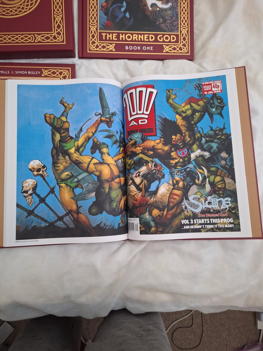 ADR2099's tweet photo. Finally arrived and looking incredible!
Slaine the Horned God anniversary edition  by @PatMillsComics and Simon Bisley from @2000AD

Bigger than what I was expecting- see photo compared to a DC absolute edition 🤯
#slainethehornedgod
#2000adcomics https://t.co/ujw5e1qkiV