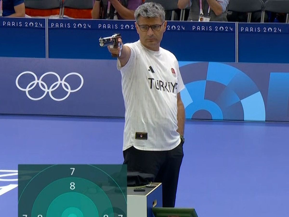 scenario20's tweet image. This is for sure Yusuf Dikec's ball and chain.. The ol' lady. #TheHighTable #JohnWick #Paris2024