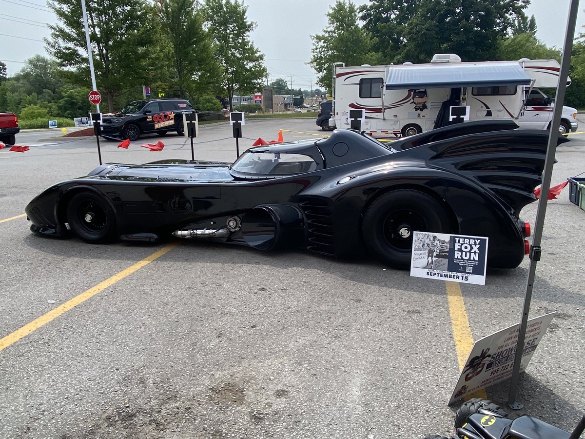 prefect's tweet photo. Muvver went to town today. It was very busy because of bank holiday weekend. Didnโt stop Batman tho!!!! He had to go and help someone (himself, 34 degrees) so isnโt in the picture. But mum saw him!!! #Batman #Batmobile #CapedCrusader #TerryFoxRun #Cancerreaserch https://t.co/vIbGzj0tTQ