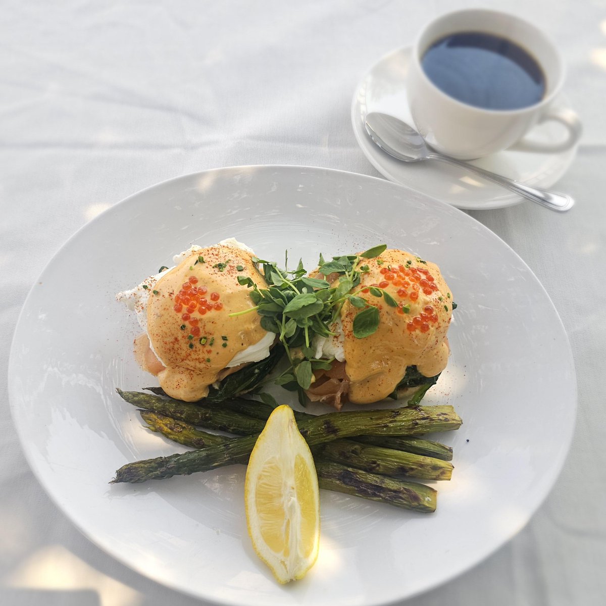 Chef's Special For Sunday Jazz Brunch, Eggs Royale.  English Muffins, Smoked Salmon, Poached Eggs, Hollandaise Sauce, Salmon Roe &amp;  Watercress.  Served With Grilled Asparagus.