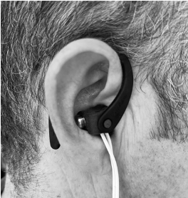 This isn't for music—it's a vagus nerve stimulator (VNS) buzzing my right ear. This form of VNS targets a branch of the vagus nerve around the ear. It lowers my heart rate, increases heart rate variability, and creates a sense of calm. (1/4)