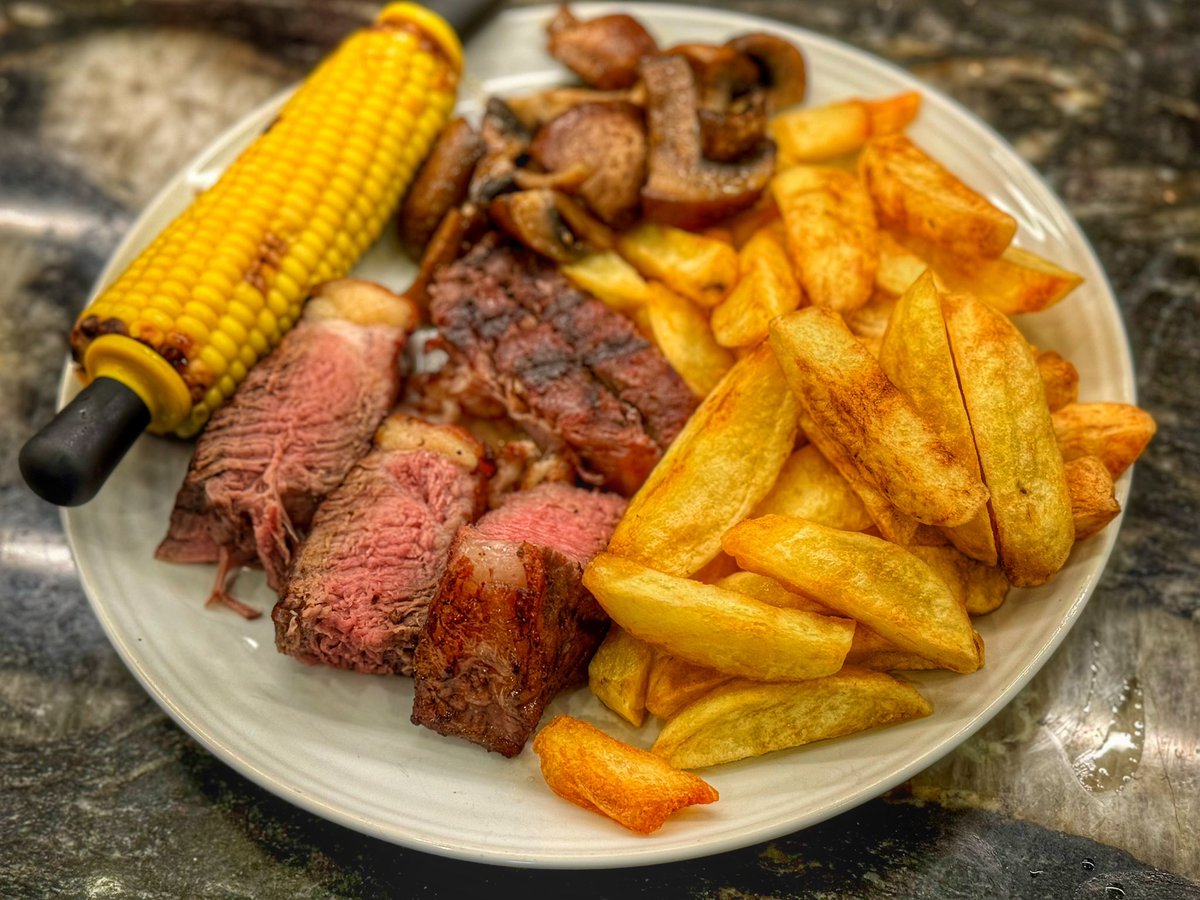 cooksdigest's tweet photo. A tasty 32oz T-bone steak from @SherwoodFoods1 cooked in the @SousVideSupreme and seared in #themightyminimax served with sweetcorn mushrooms and amazing chips made from @waitrose wonky potatoes @BigGreenEggUK @EdHenriet #bge #biggreenegg https://t.co/q5dtYc9PaH