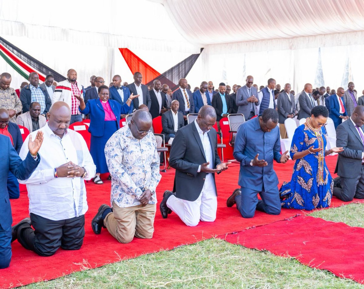 President Ruto and other leaders on their knees while being prayed for during a church service in Narok County