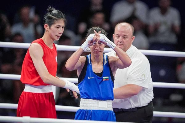 Bulgarian boxer Svetlana Staneva holds up an XX symbol after losing to Lin Yu-Ting, a biological male (XY):