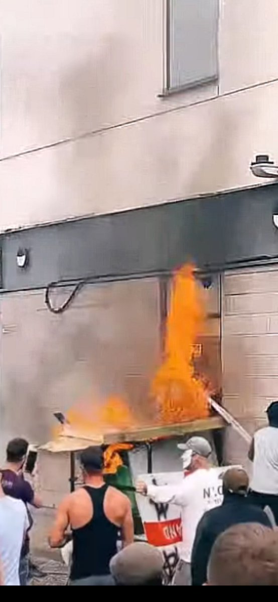 People are in the hotel.

This is arson with intent. A life sentence offence.