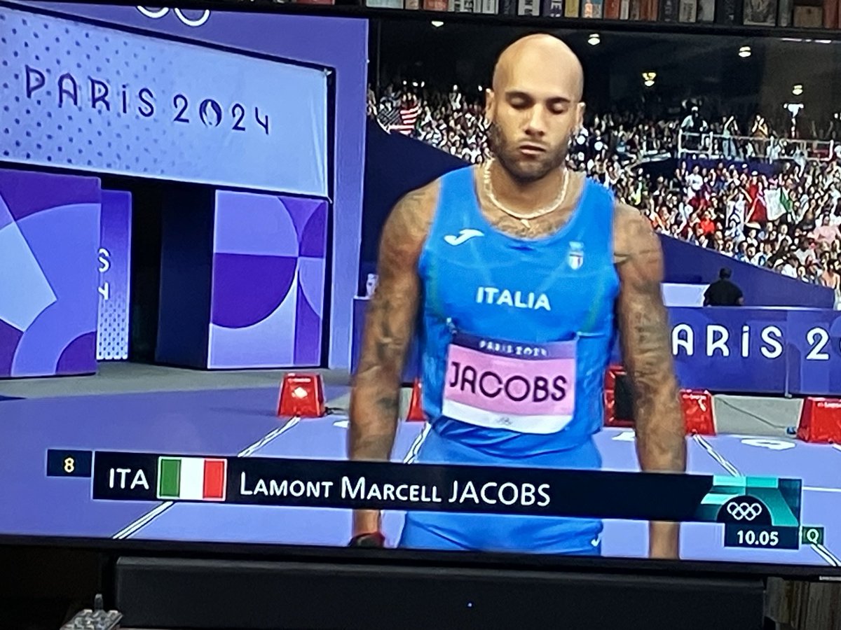 I love it that it’s the Olympic men’s 100m semi-final; yet the reigning champion - like all the others -  has to safety pin  his number to his vest.