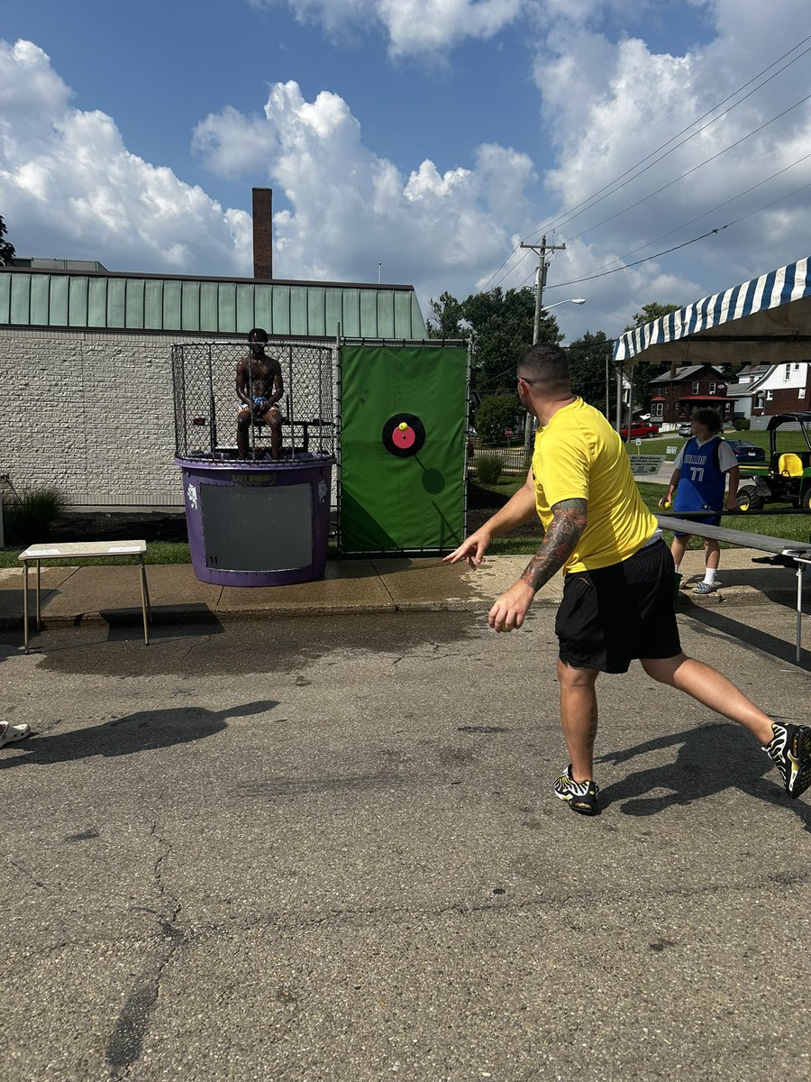 Titan football players and coaches working the game booth’s &amp; dunk booth at the St. Bernard German Luau festival over the weekend..