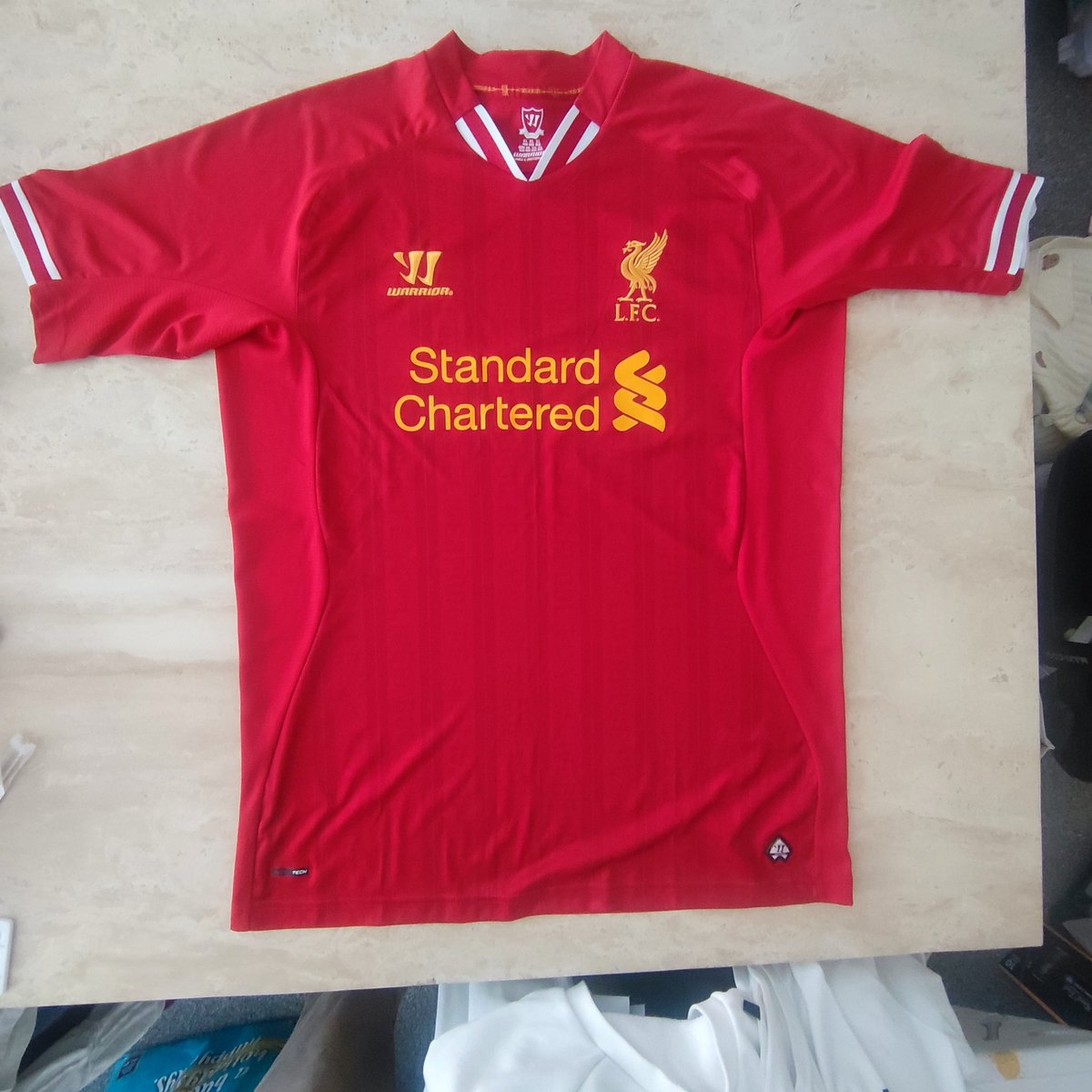 AdrianT90's tweet photo. @shirt_x 3 x Liverpool Shirts size XL

2013/14 in excellent condition - £25
2012/13 in very good condition, wear to the warriortech print bottom right of shirt, slight cracking to sponsor - £18
2015/16 in excellent condition - £25

Includes UK postage

£55 takes the lot. https://t.co/CtMc8sv924