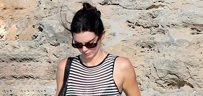 Kendall Jenner Exudes Chic Style in Sheer Striped Dress During Relaxing Formentera Getaway