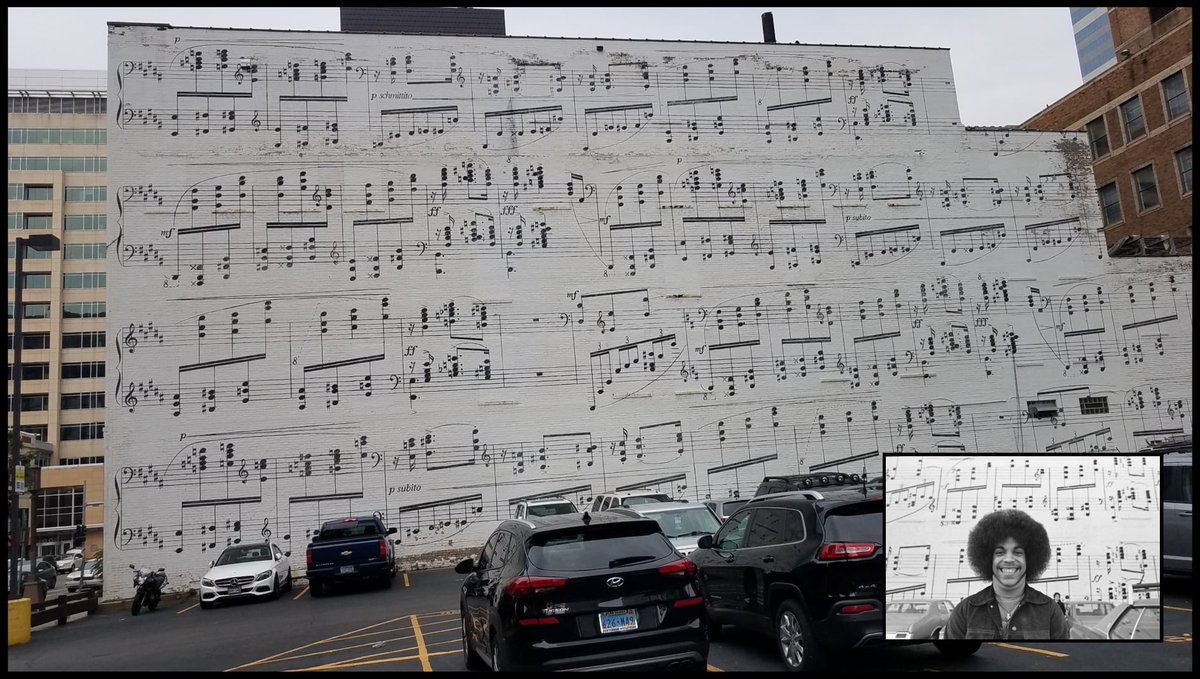 PhilBerbig's tweet photo. This was in my "Memories' from 4 years ago. I remember taking this shot downtown Mpls and wondering how old the painting was. I found a picture of it from the 1970's with some random guy blocking part of the view of it, but never did find out the original date of the mural. https://t.co/JU4niwRxXh