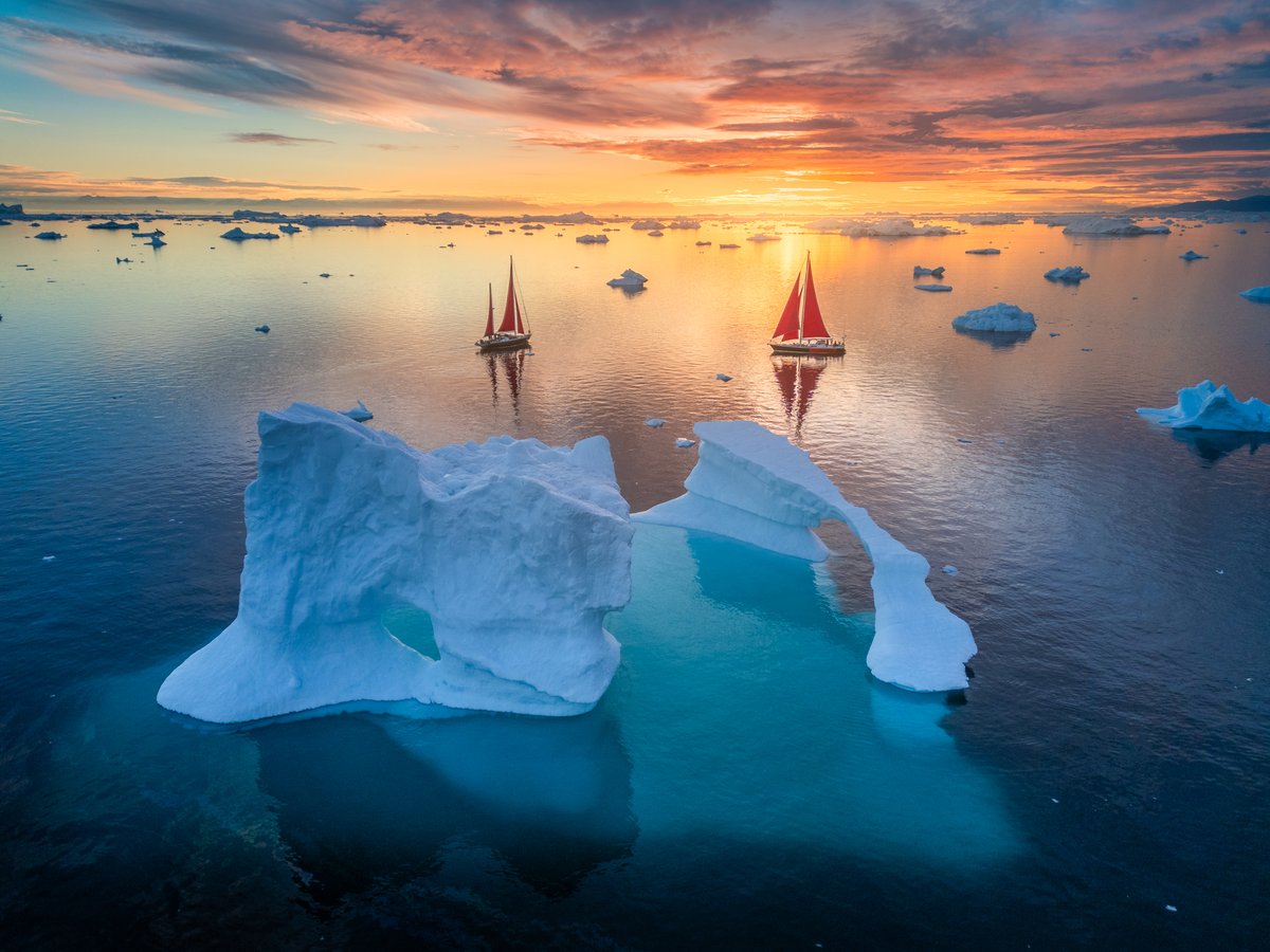 albertdrosphoto's tweet image. Moments with our red sail boats in Greenland from this year.