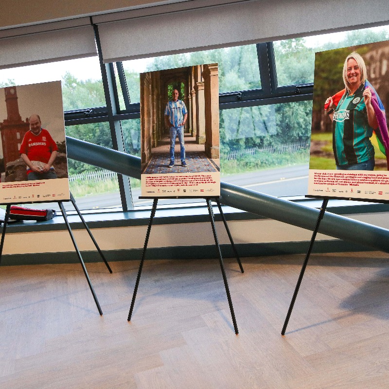 Boro's tweet photo. The @RiversideStad was host to last night's launch of #MyBoroMyShirt, a photography exhibition which celebrates the diversity of the #Boro supporting community 📸👕 #UTB #RiverSideBySide