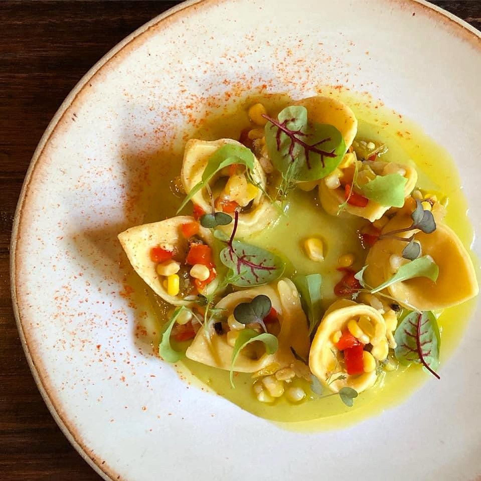 Ricotta &amp; Chèvre Tortellini, roasted tomatillo &amp; basil coulis, sour corn relish, &amp; pepper mash. 

#summer #pasta #seasonal #yum
